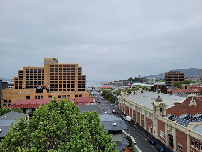 Elevated view over Hobart's CBD rooftops and waterfront towards the Derwent River