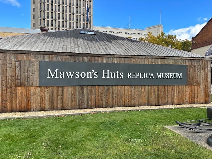 Exterior sign and timber-clad facade of Mawson's Huts Replica Museum in Hobart